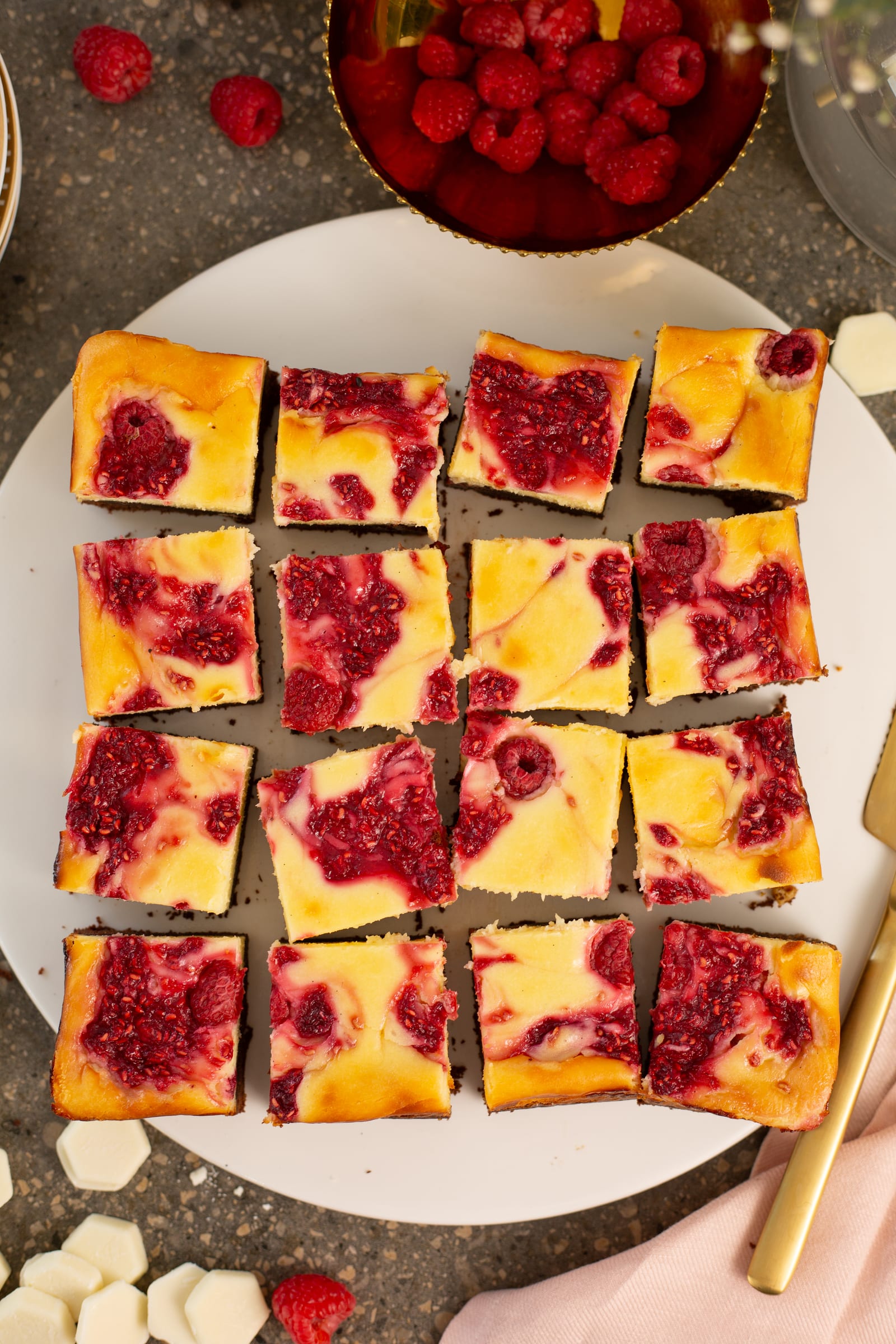 Raspberry ripple cheesecake brownie bars cut into squares, from above