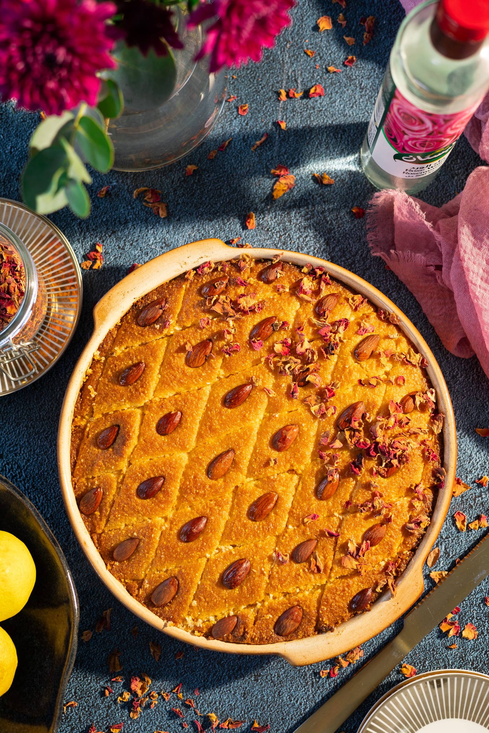 The basbousa from above, with roses, rose water and lemons