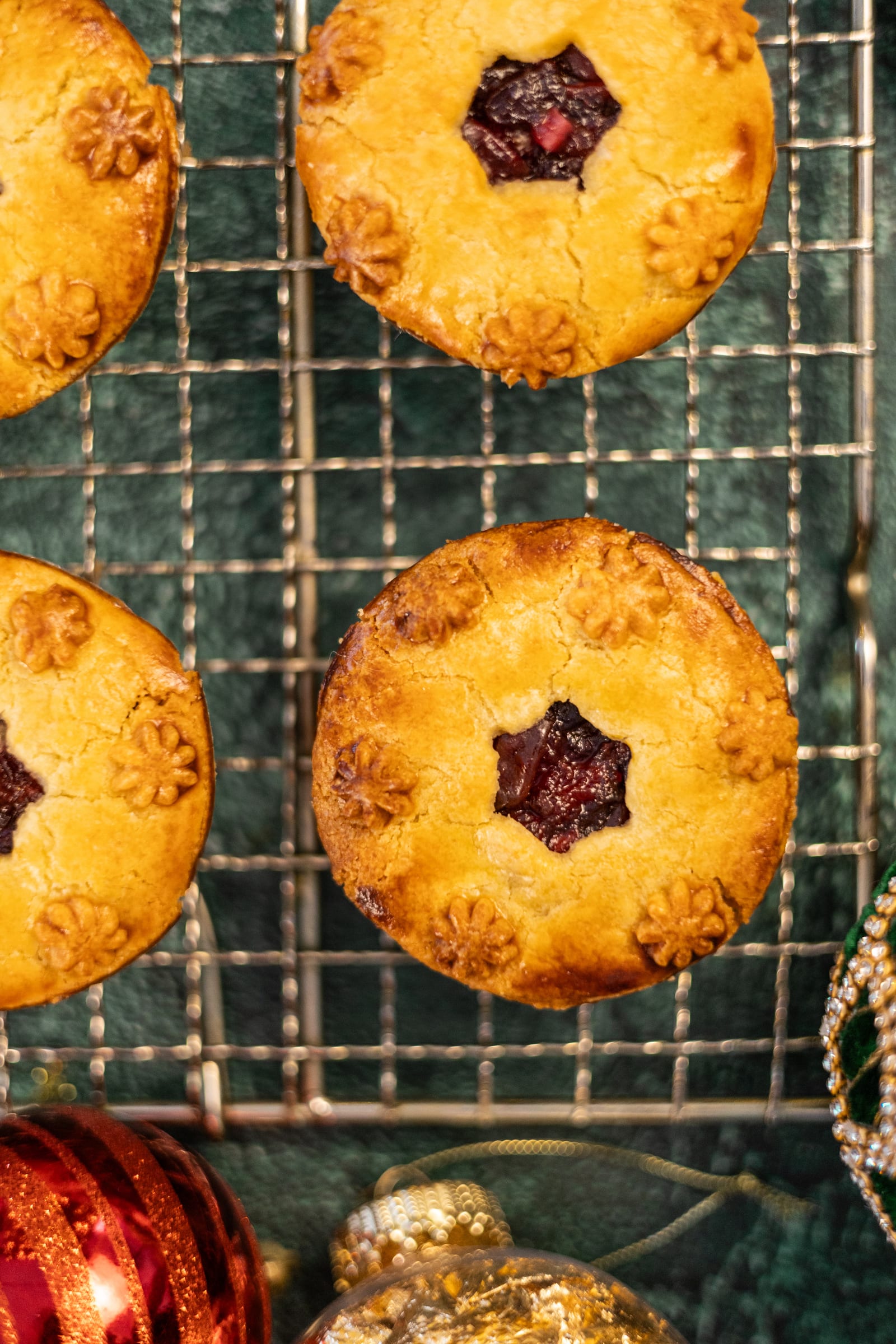 Close-up of a golden pie with a star cut-out showing the cherry filling