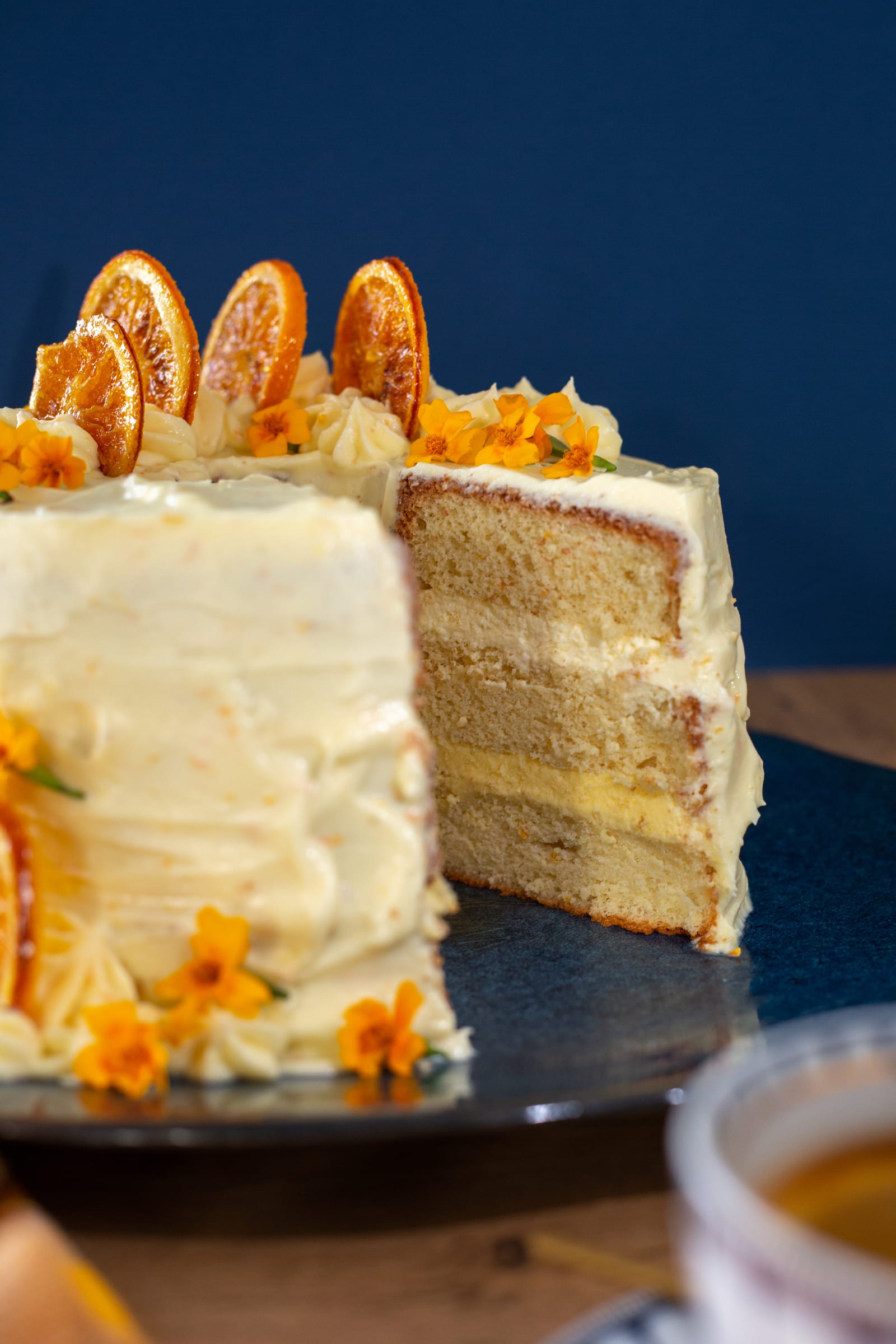 The cut face of the orange cream chiffon cake, showing its sponge and cream layers