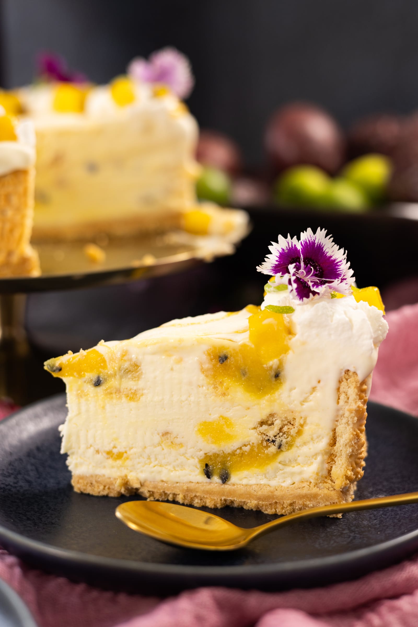 A slice of ice cream cake studded with passionfruit and biscuit