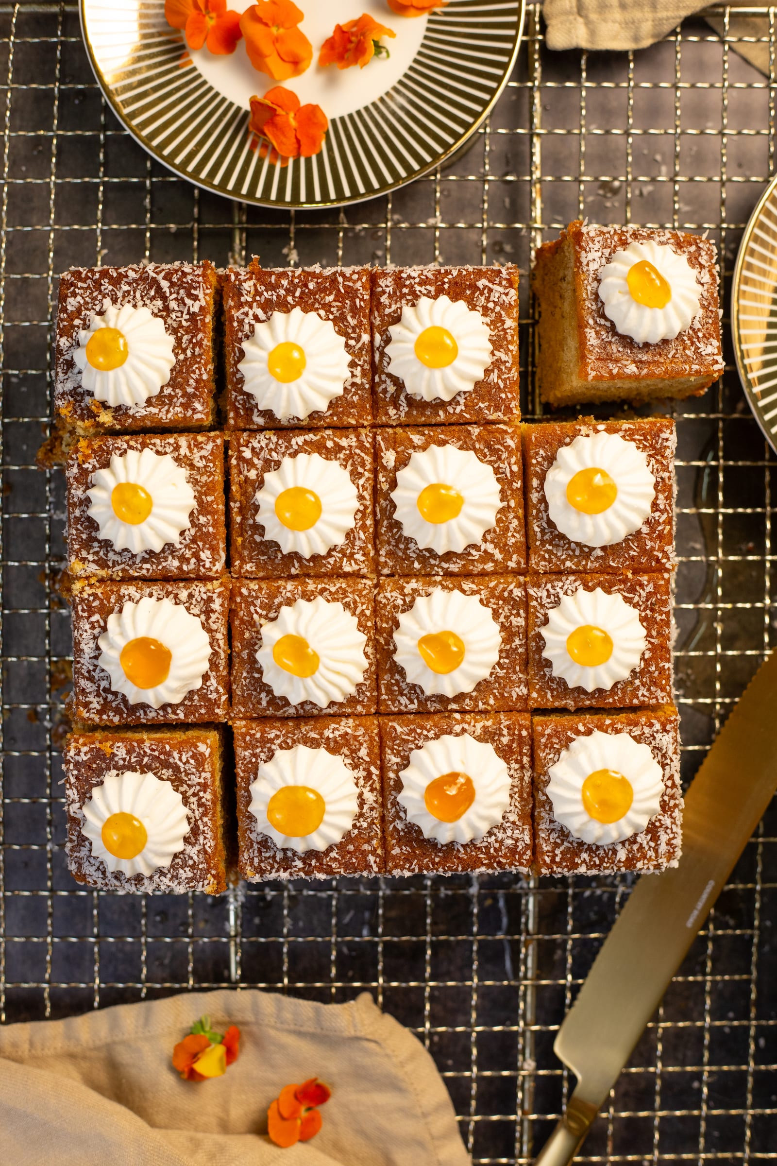 The koesister traybake cut into squares on a rack, from above
