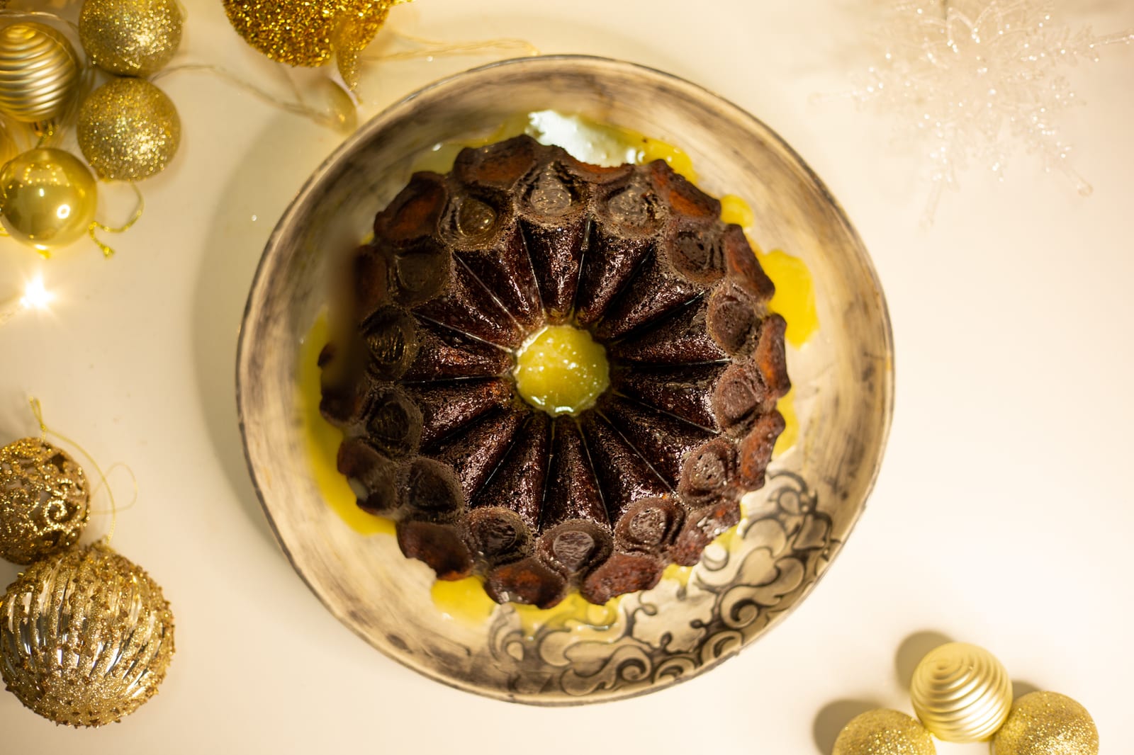 The gingerbread pudding from above, in a pool of sauce