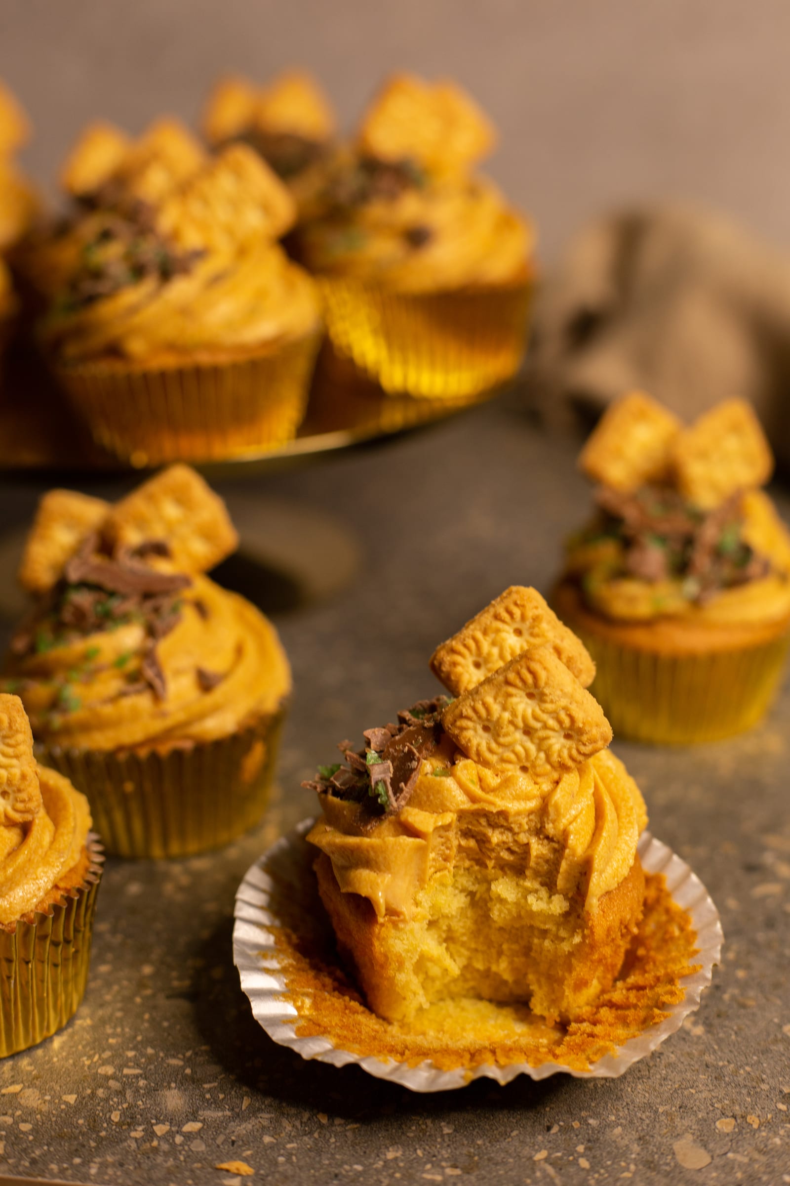 A cupcake with a bite taken out, showing its crumb