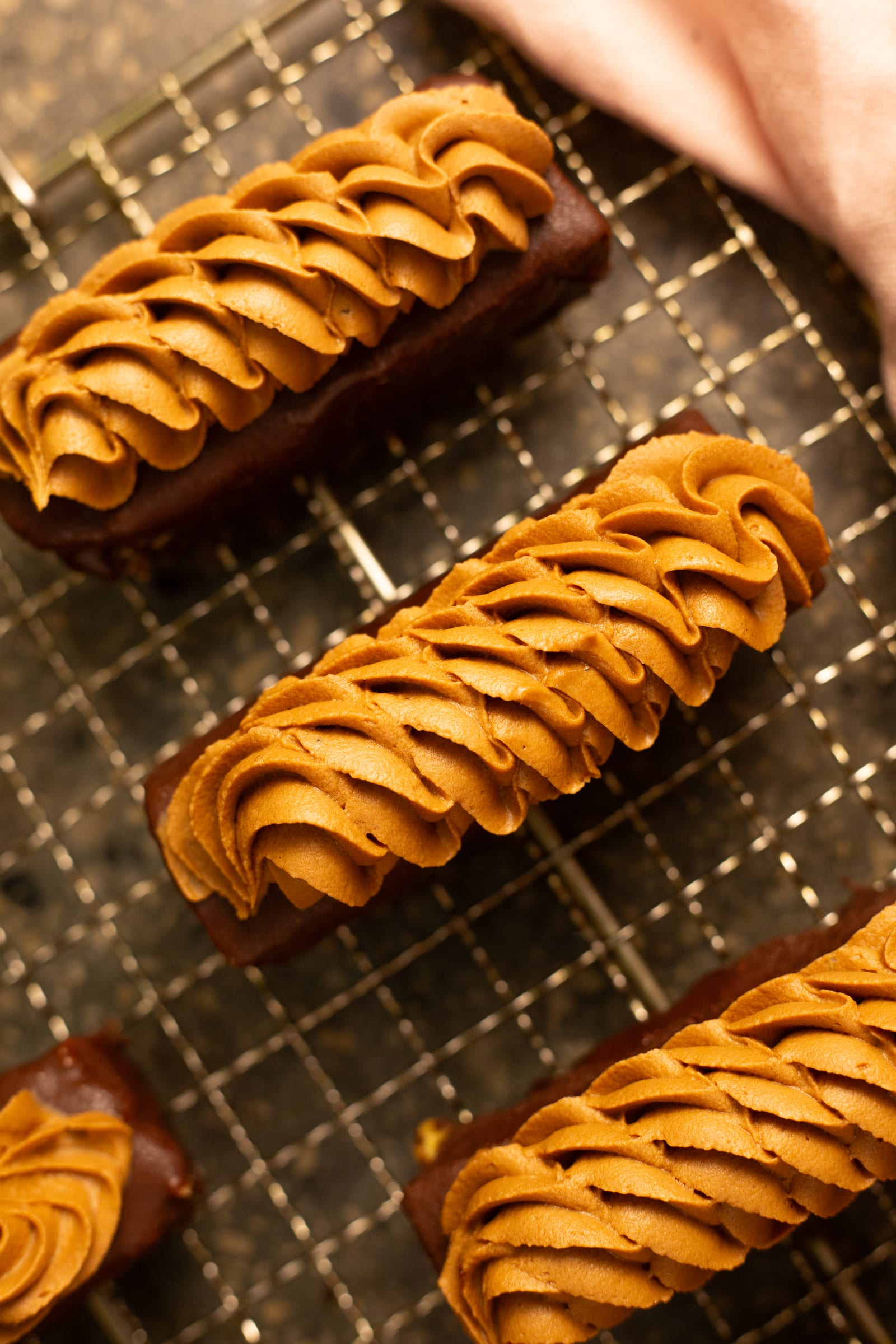 Close-up from above of the swirled milk chocolate caramel ganache on the brownie fingers