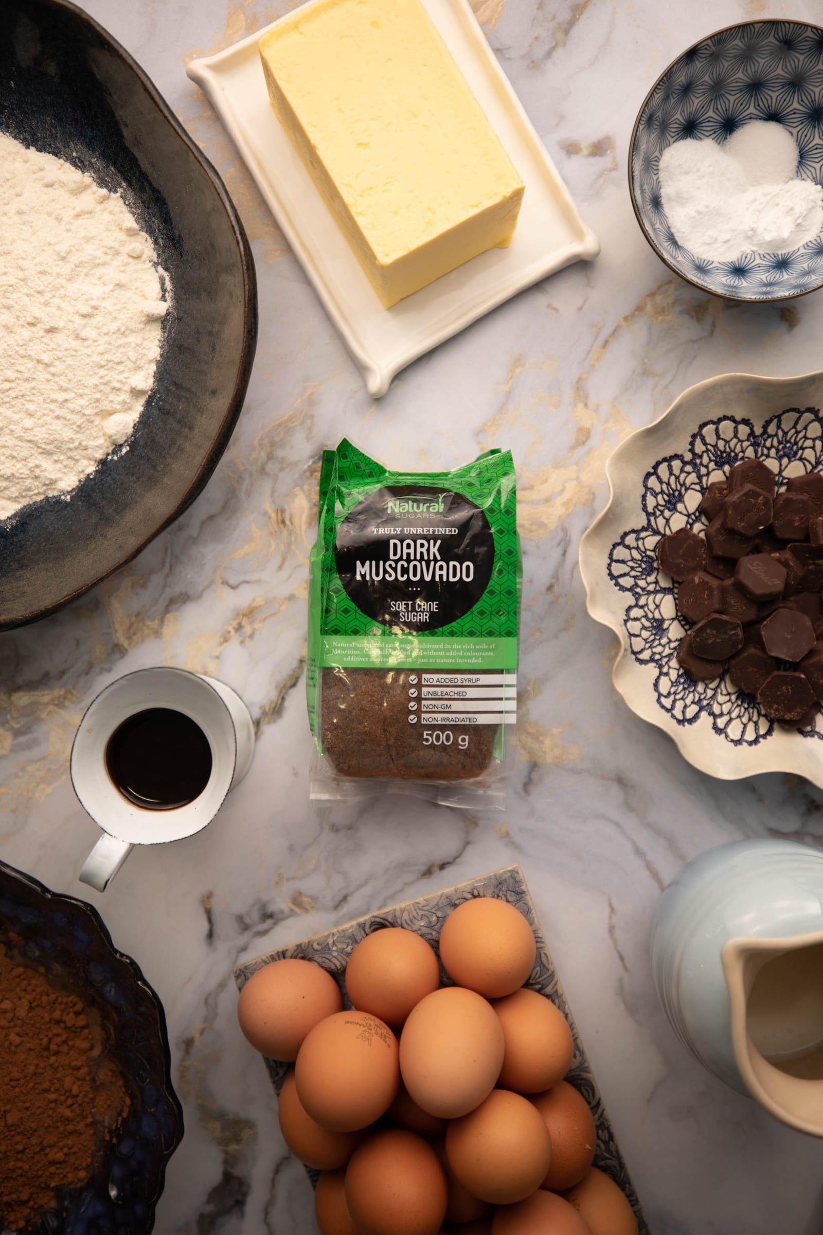 The ingredients for chocolate fudge cake, with the pack of dark muscovado sugar, from above