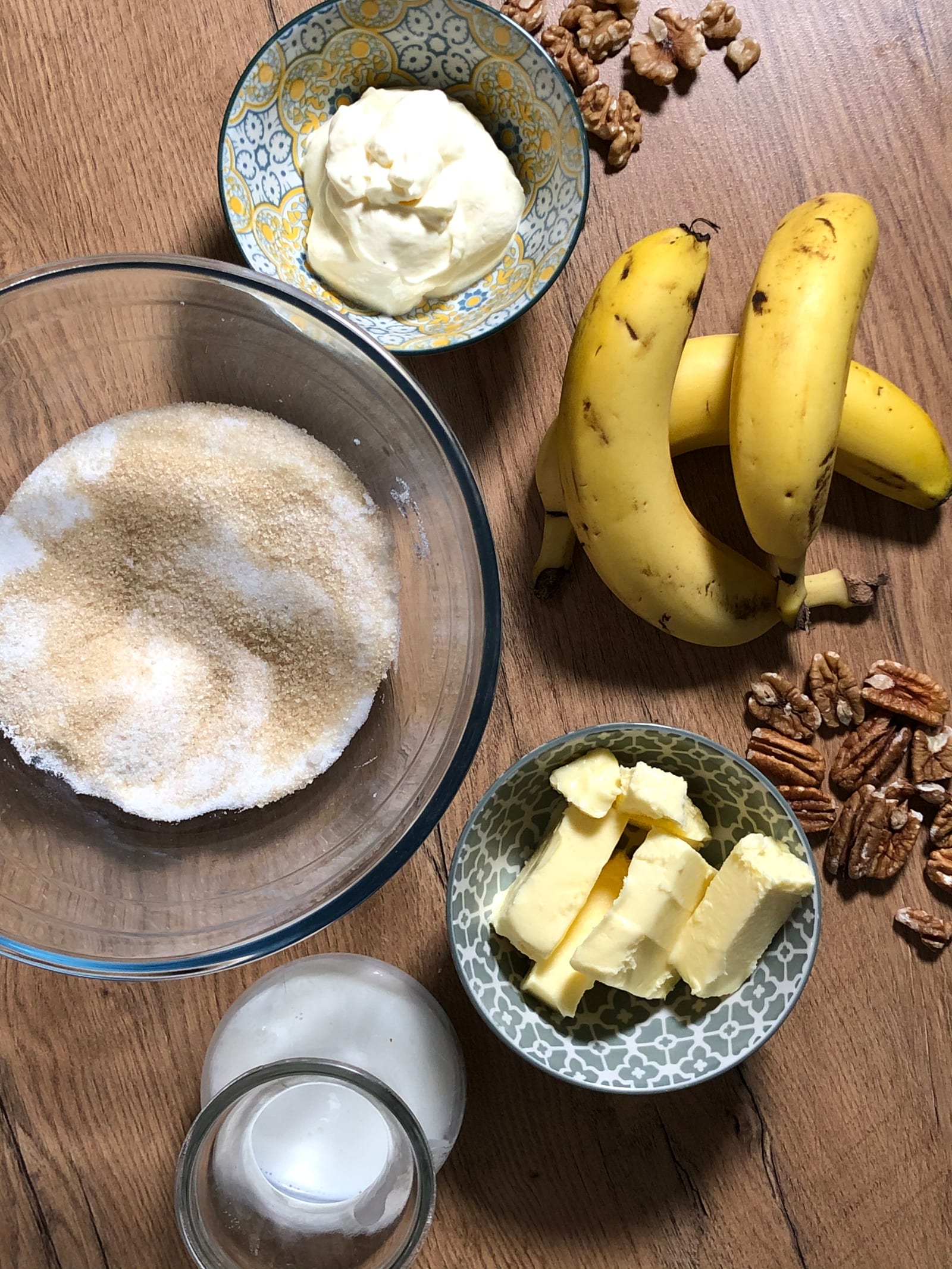 Bananas, pecans, butter and the other ingredients for banana and pecan nut bread, from above
