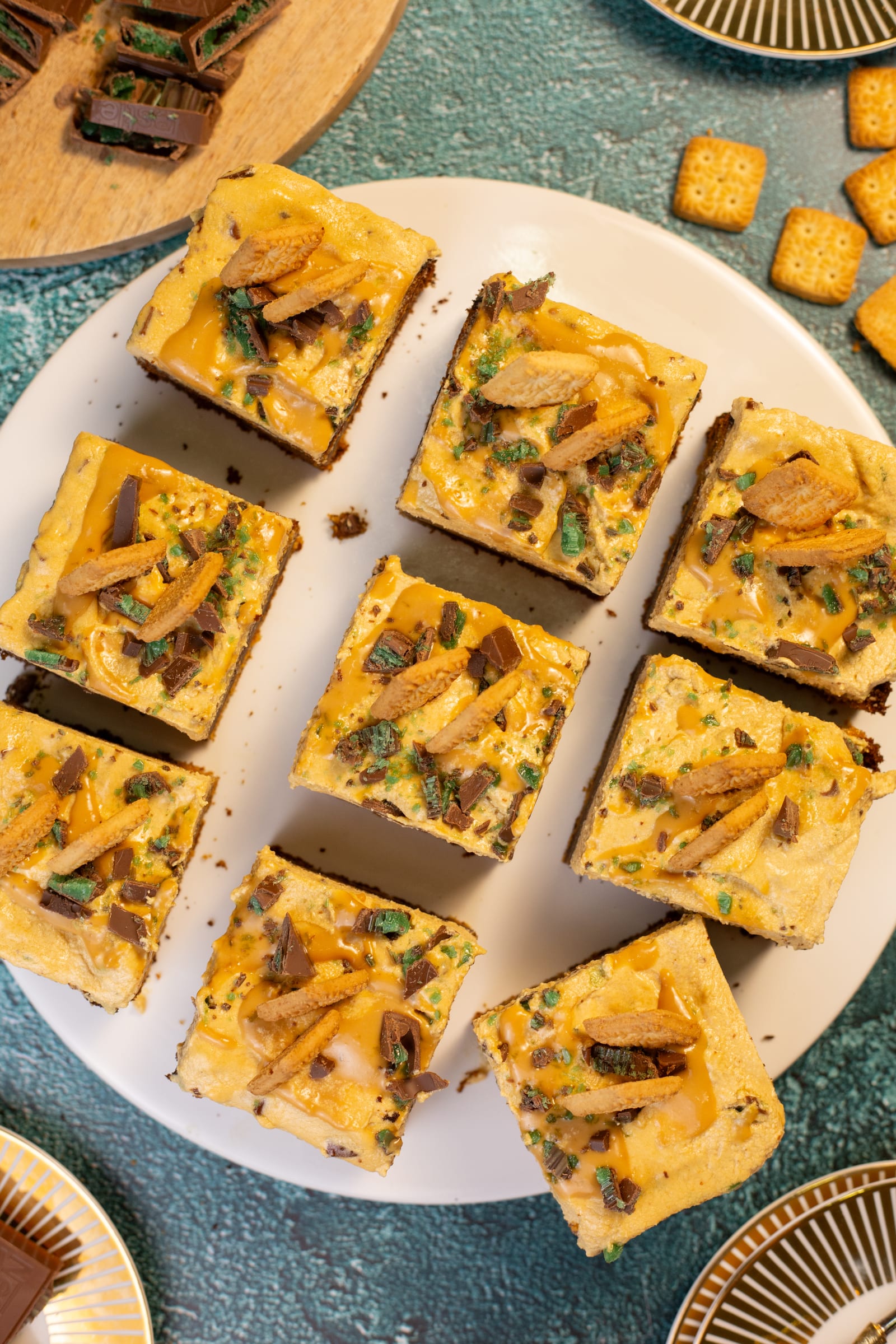 The traybake cut into squares on a white plate, from above