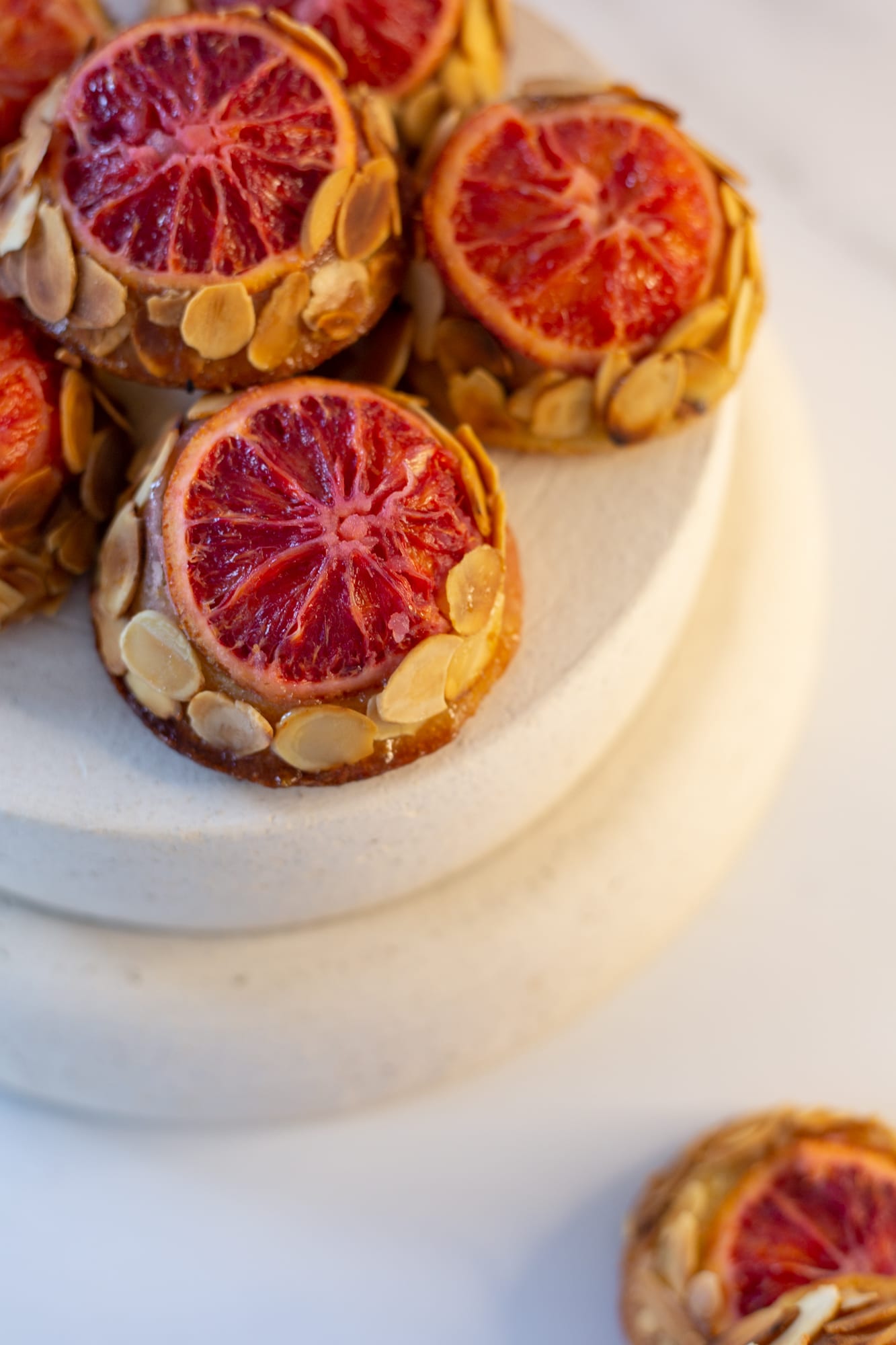 Close-up of a blood orange slice on top of a blood orange and almond tea cake