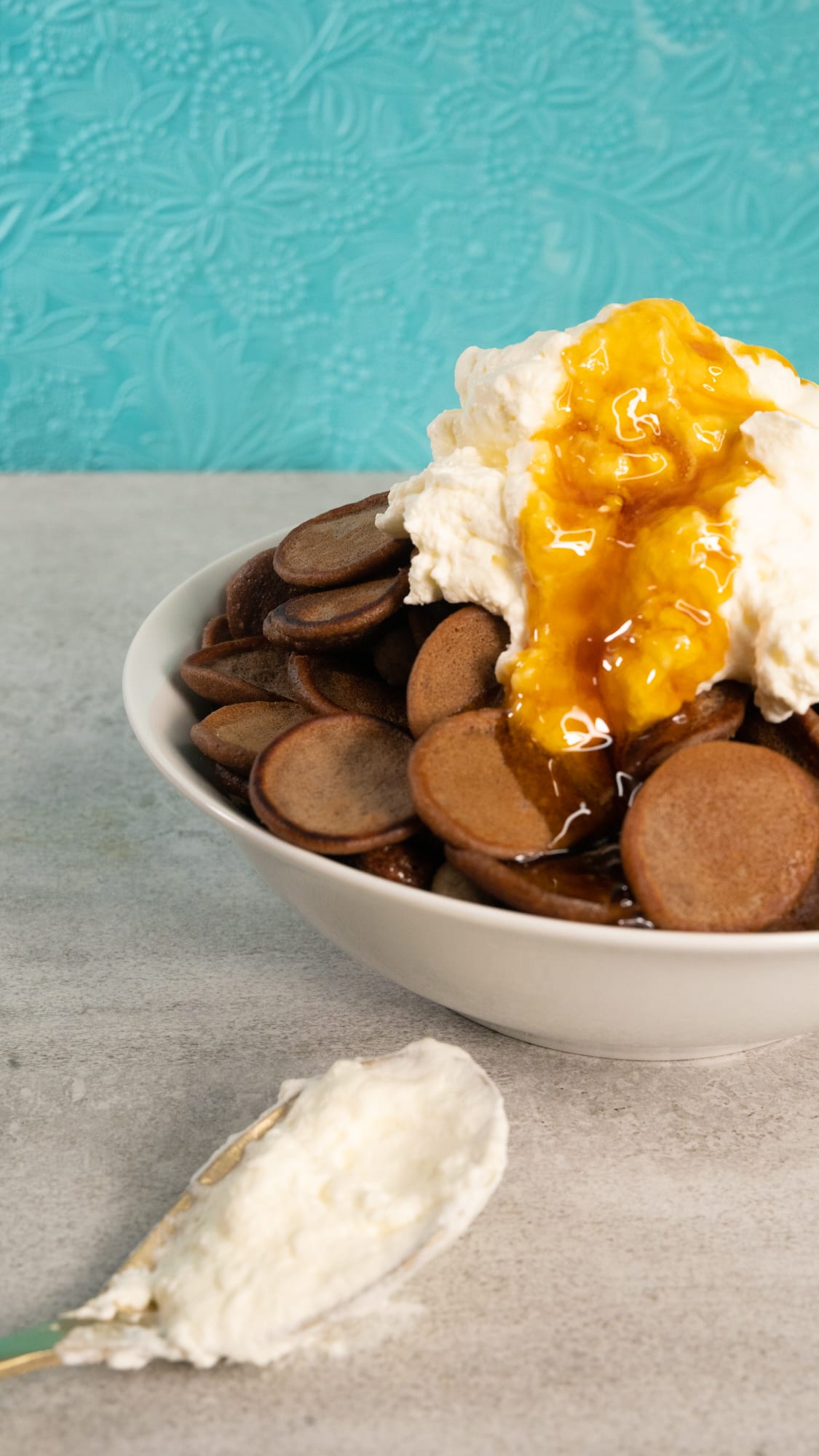 Close-up of syrup pooled over the cream on a bowl of Milo pancake cereal